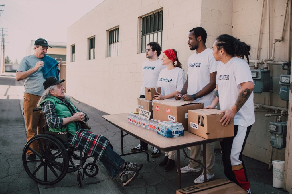 Nonprofit volunteers handing food out to people