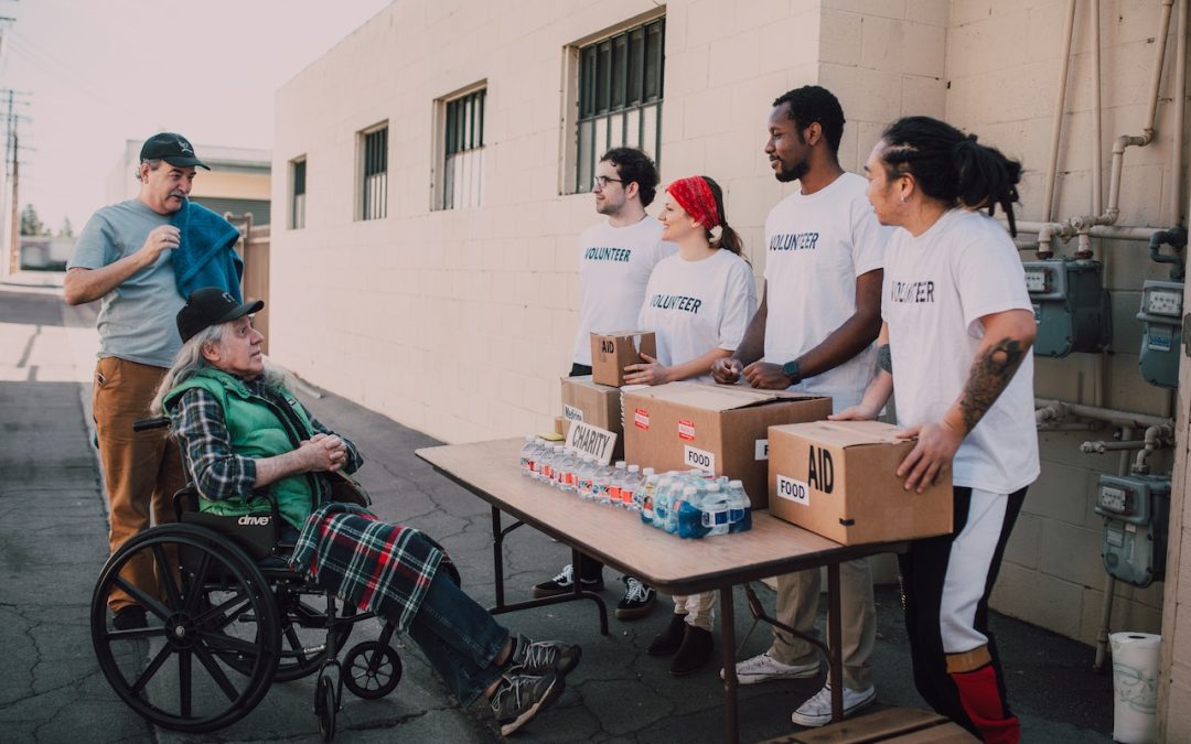 Nonprofit volunteers handing food out to people